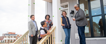 people standing on front porch